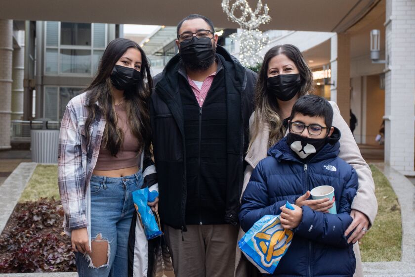 From left: Lili, Andy, Clarissa and Adan Brisena stand at Oakbrook Center mall as they enjoy their Christmas Eve shopping tradition.