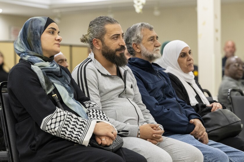 Wadee Alfayoumi’s father Odai Alfayoumi, center left, sits in during a one year remembrance and prayer service for his son who was fatally stabbed last year, at the Muslim Community Center in Irving Park, Monday, Oct. 14, 2024.