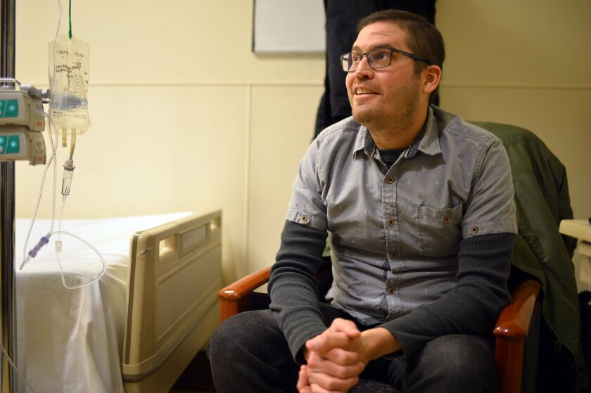 Cancer patient Sean O’Reilly, waiting to receive chemotherapy with a specialized hepatic artery infusion pump at the Robert H. Lurie Comprehensive Cancer Center.