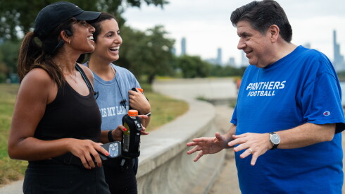 Two female joggers talk to Gov. JB Pritzker on the Lakefront Trail at 31st Street Beach on Sept. 16, 2026.