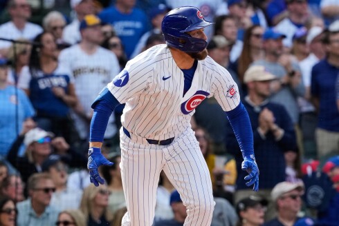 Michael Busch watches his two-run single during the eighth inning of Sunday's game.