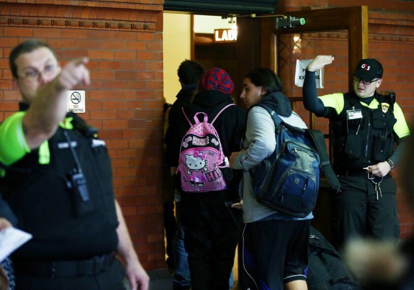Several people who were on an Amtrak train that derailed south of Seattle arrive in Portland, Ore. by bus on Monday. |<br>Dave Killen/The Oregonian, distributed by the Associated Press