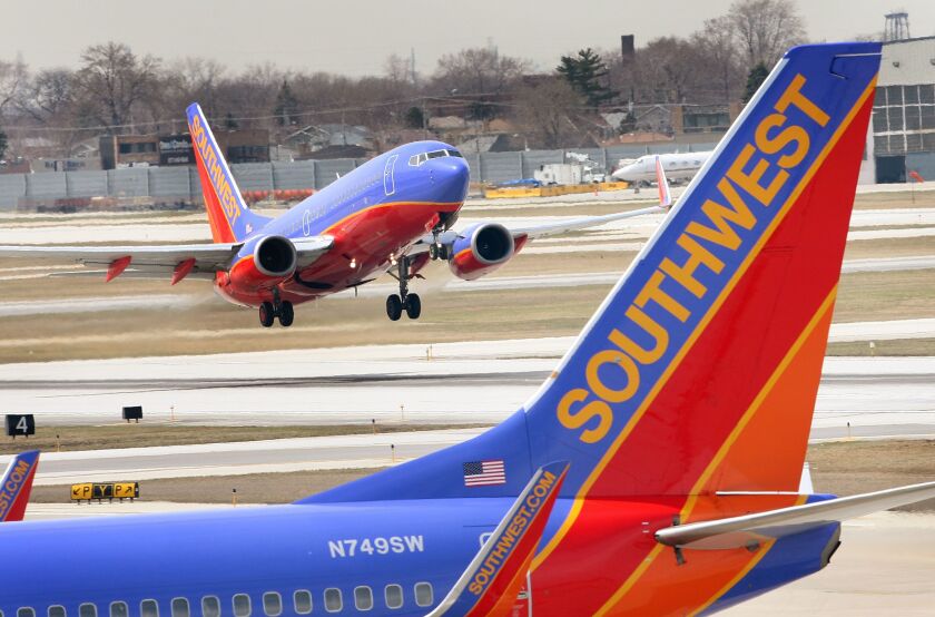 A Southwest Airlines jet takes off at Midway Airport.