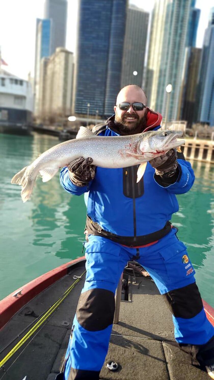 Tim Prokop with his lake trout caught near shore in Chicago. Provided photo