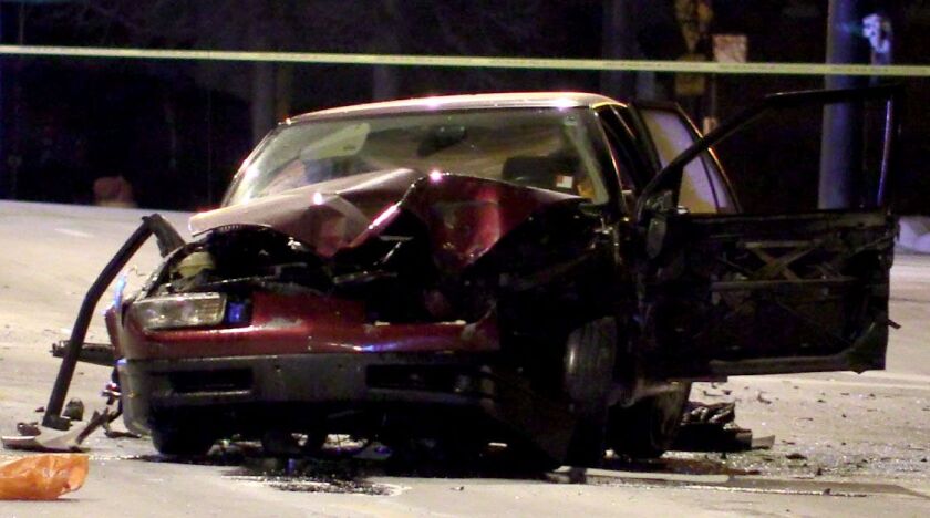 A vehicle that crashed into a light pole during a chase with police early Sunday on the West Side. Justin Jackson/Sun-Times