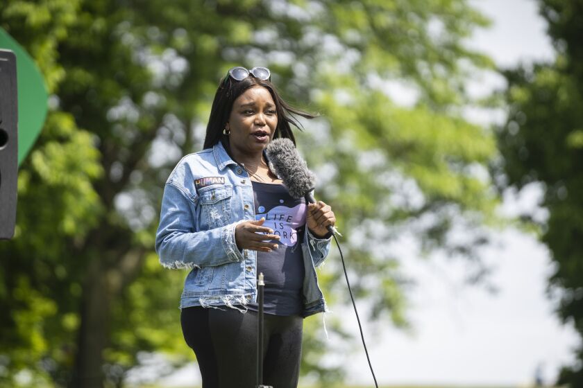 Zahara Bassett, founder of the nonprofit social services organization Life Is Work, speaks about the attacks on the Black trans members of the community during a rally for the Chicago Reclaim Pride March at the AIDS garden on Sunday, June 12, 2022.