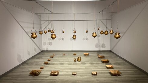 “Memory Leaks: Drips and Traces,” installation view 2014 Etched copper dharapatras and havankunds, burnt newspapers and books, water. Featured in “Unbearable Memories, Unspeakable Histories,” at the South Asia Institute.