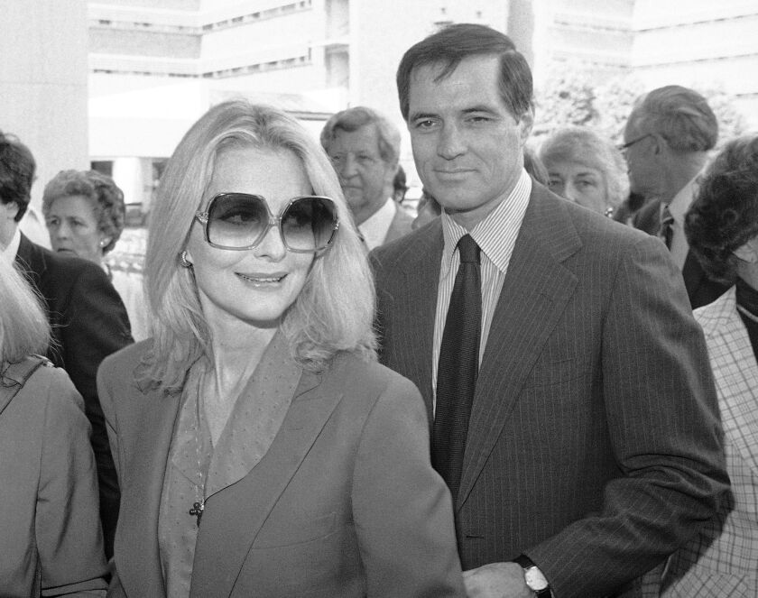 In this May 3, 1981 file photo, John Gavin and his wife Constance arrive for a memorial service for Jules Stein in Los Angeles. Gavin died Friday, Feb. 9, 2017. He was 86. | AP Photo/Lennox McLendon, File