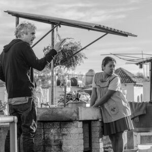 This image released by Netflix shows filmmaker Alfonso Cuaron on the set of “Roma,” premiering Oct. 5. | Carlos Somonte/Netflix via AP