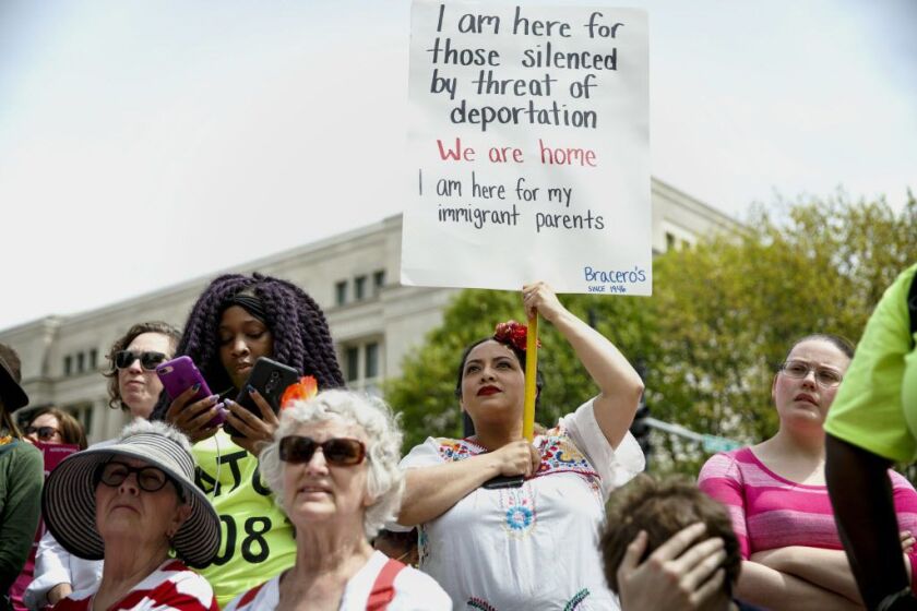 Joann Flores-Deter supports rights for immigrants at the Illinois Women March on Springfield rally at the Capitol in Springfield, Ill., April 25 2017, in Springfield. (Rich Saal/The State Journal-Register via AP)
