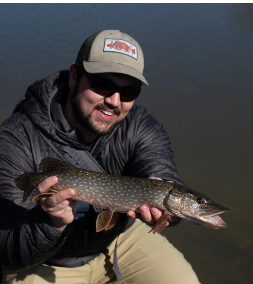 Tim Adkins with a northern pike from the Forest Preserves of Cook County. Provided