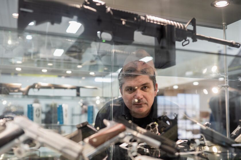 Jeff Regnier, owner of Kee Firearms and Training, in his shop in New Lenox last week.