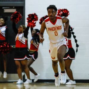 North Lawndale’s Jamar Wilkins (0) looks up at the scoreboard after scoring against Farragut.