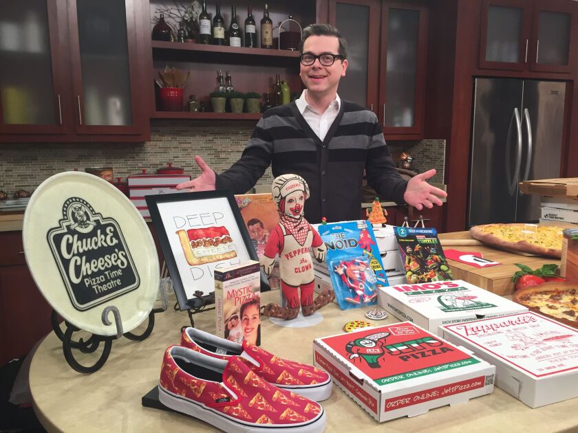 U.S. Pizza Museum founder and director, Kendall Bruns, with items from the Chicago museum’s collection. | Provided by U.S. Pizza Museum