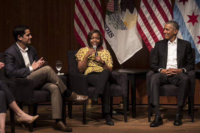 Former President Barack Obama listens as Dr. Tiffany Brown, a pharmacist, chats about community organizing and civic engagement at the University of Chicago’s Logan Center for the Arts on Monday, April 24, 2017. | Ashlee Rezin/Sun-Times