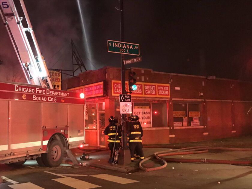 Firefighters put out a fire in a commercial building Saturday night in the 200 block of East 71st Street. | Chicago Fire Media