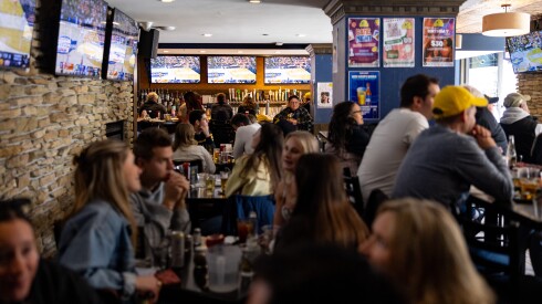 Michigan fans watch their team play in the Elite Eight at Duffy’s Tavern & Grille in Lincoln Park.