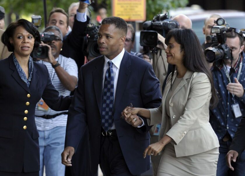 Former Rep. Jesse Jackson Jr. and his wife, Sandi, arrive at federal court in Washington for their sentencing in 2013. | AP File Photo/Susan Walsh