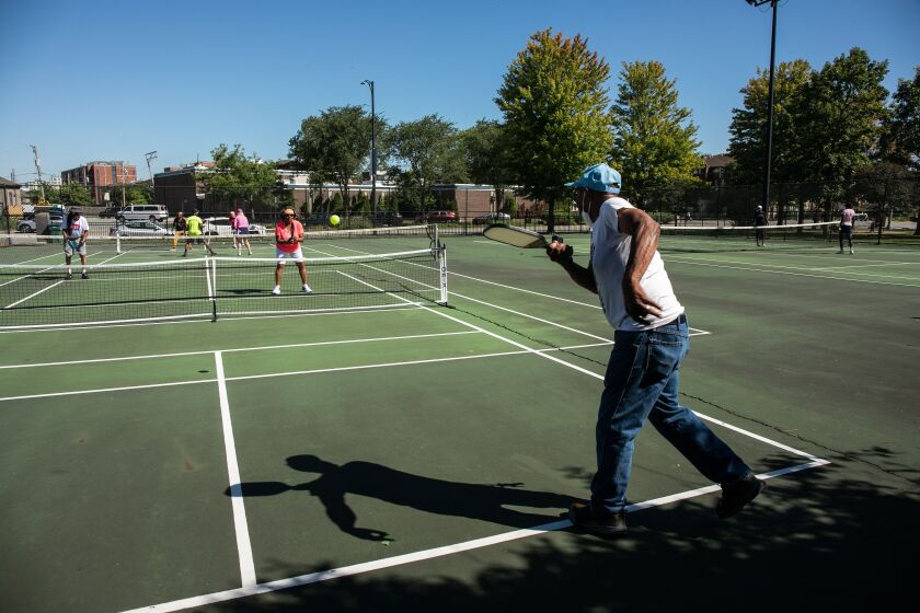 Quinnie Edwards, 82, plays pickleball with Kassandra Scott, 71, at Mandrake Park this week.