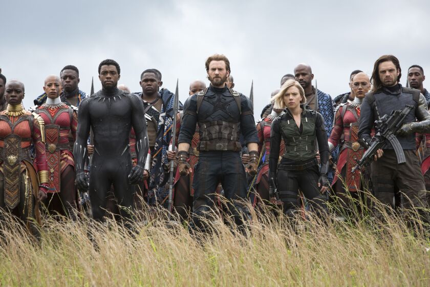 Danai Gurira (left) and Chadwick Boseman of “Black Panther” co-star with Chris Evans, Scarlet Johansson and Sebastian Stan in “Avengers: Infinity War.” | ©Marvel Studios 2018