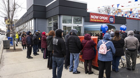 Customers line up before the opening of the renovated Save A Lot grocery store at 4439 W. 63rd St.