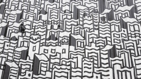 A black and white cityscape on a mural.