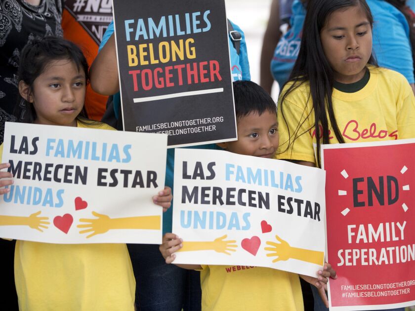 Children hold signs during a demonstration in front of the Immigration and Customs Enforcement offices in Miramar, Fla. The Trump administration’s move to separate immigrant parents from their children on the U.S.-Mexico border has turned into a full-blow