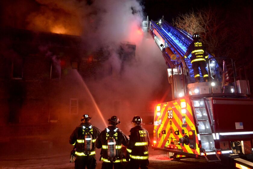 Firefighters put out a second-alarm fire that started Thursday night in the South Side Englewood neighborhood. |<br>Justin Jackson/Sun-Times