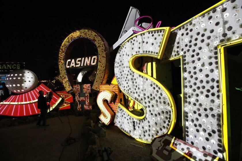 In this Jan. 24, 2018, photo a videographer photographs an exhibit at the Neon Museum in Las Vegas. | John Locher/AP