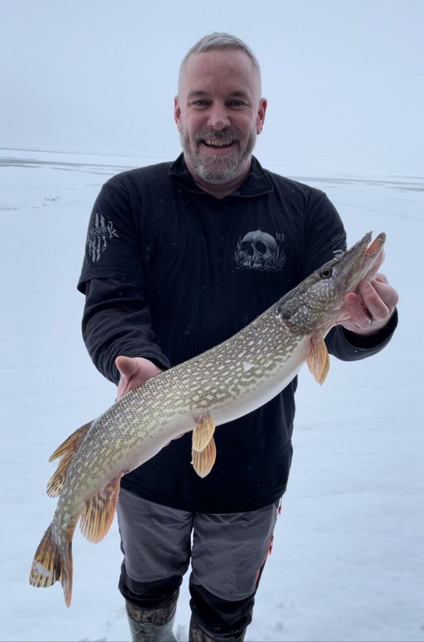 Courtney Dornfeld, from Glen Ellyn, with a Lake Puckaway northern pike. Provided by Mike Norris