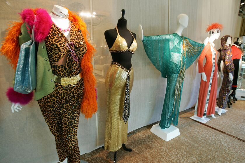 Costumes designed for Cher by Bob Mackie were displayed ahead of a 2006 auction by Sotheby’s. | ROBYN BECK/AFP/Getty Images
