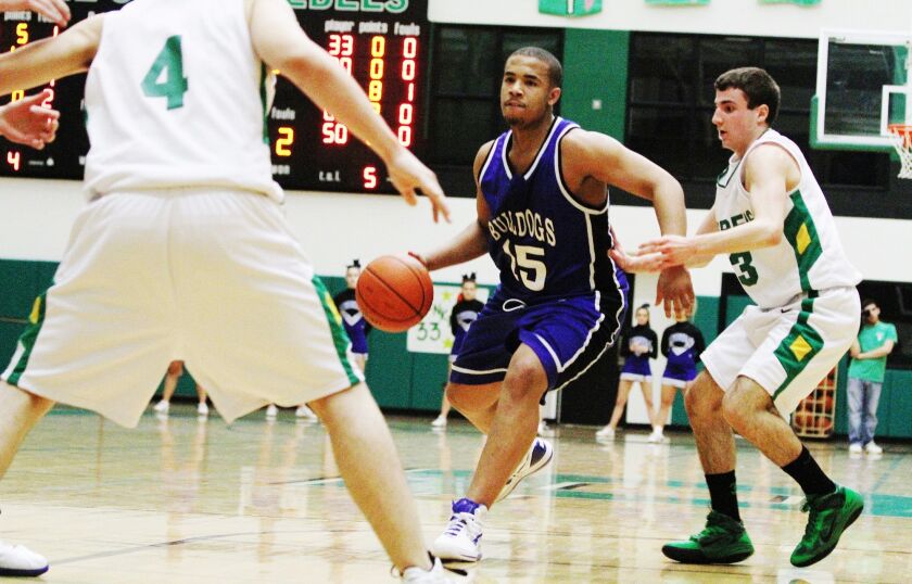 Riverside-Brookfield’s Ryan Jackson (15) dribbles past Ridgewood’s John Caravia (3) in 2011.