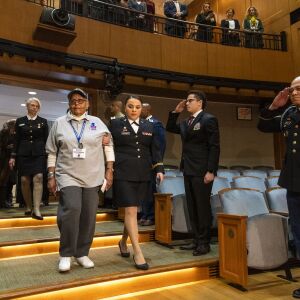 Women veterans of every branch of the U.S. military, file through an auditorium at the Pritzker Military Museum and Library for the announcement of the first all women honor flight to Washington D.C. later this year, Tuesday, Feb. 25, 2020.