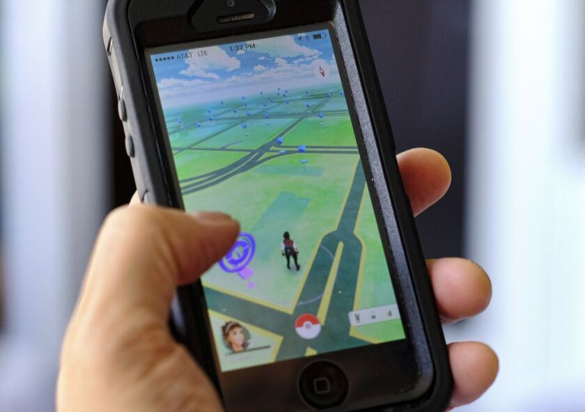 Pokemon Go is displayed on a cellphone. | Richard Vogel/AP