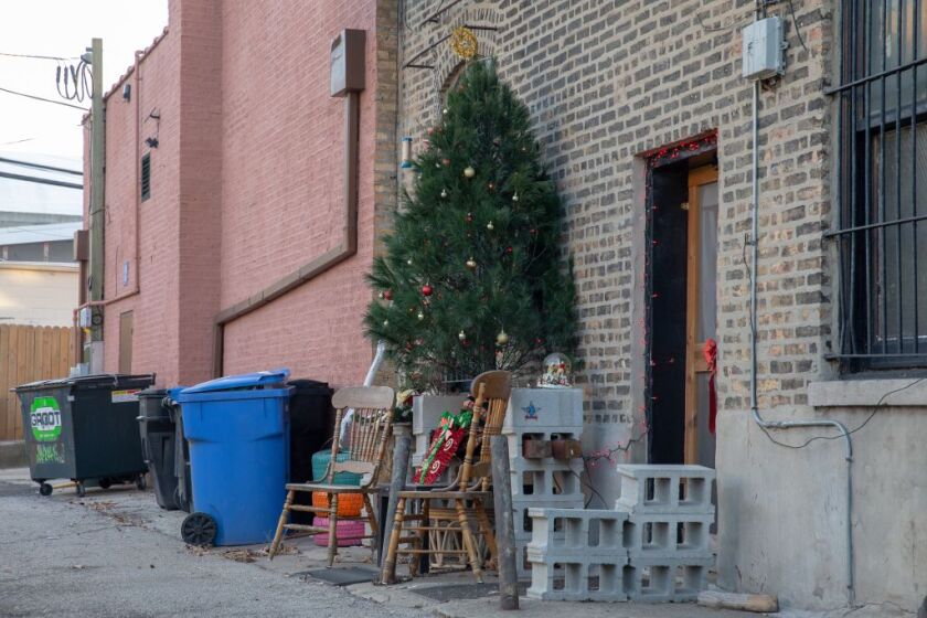 Angela Eve’s Christmas display sticks out among trash cans in an alley behind her Logan Square home. | Nader Issa/Sun-Times