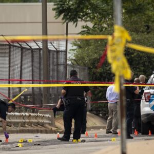 Chicago Police investigate at the 25th District station, 5555 W. Grand Ave., on the Northwest Side, after multiple officers were shot outside the station, Thursday morning, July 30, 2020. The suspect was also shot multiple times in the incident.