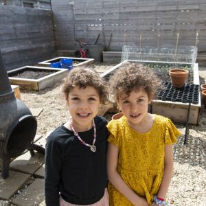 Hilde and Elsie Shapiro-Braddy pose in their garden, Tuesday, April 28, 2020.
