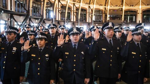 Recruits take an oath of office during a Chicago Police Department graduation ceremony on March 7 at the Aon Grand Ballroom at Navy Pier.
