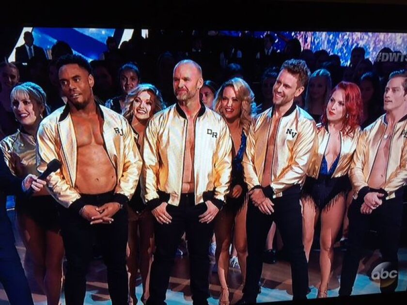 Emma Slater (from left) Rashad Jennings, Lindsay Arnold, David Ross, Peta Murgatroyd, Nick Viall, Sharna Burgess and Bonner Bolton await the judges’ scores for their group dance Monday night on “Dancing with the Stars.” | Miriam Di Nunzio/via ABC