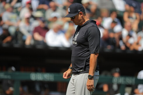 New York Yankees' manager Aaron Boone walks back to the dugout following a visit to the mound in the seventh inning of a game against the White Sox on Thursday, July 30, 2026, at Rate Field.