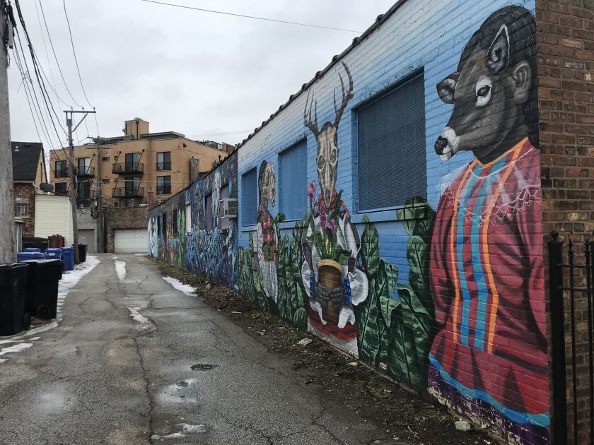 An alley near North Milwaukee Avenue and North Richmond Street features an array of murals by different artists.