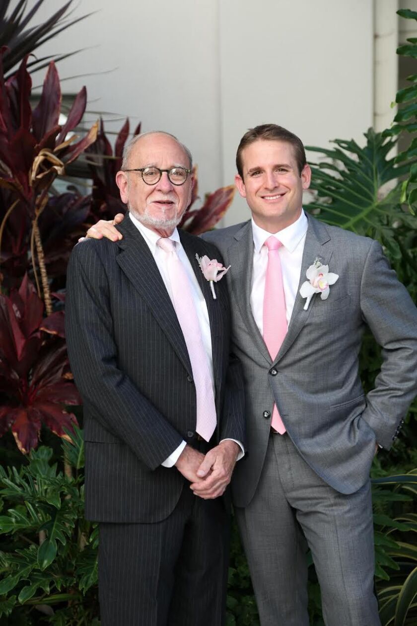 Woody Imberman with his son, Lane, on his wedding day. Unusually, he wears an orchid on his lapel rather than his favourite, a lily. Photo provided
