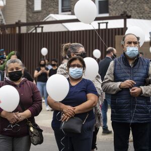People gather for a vigil for 13-year-old Adam Toledo near the location of the shooting at West 24th Street and South Sawyer Avenue in Little Village, Monday afternoon, April 5, 2021. Toledo was fatally shot in the chest by a Chicago police officer in an alley west of the 2300 block of South Sawyer Avenue near Farragut Career Academy High School.
