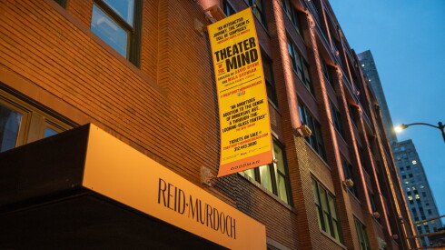 A sign for David Byrne's upcoming show "Theater of the Mind" hangs outside of the Reid Murdoch building.