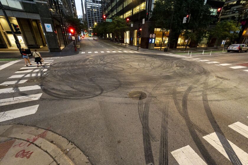 Tire marks at South Clinton and West Monroe streets in the West Loop, Monday, July 18. The marks stand as evidence of what had happened the night before, when, as a crowd gathered, cars drifted and spun around the intersection.