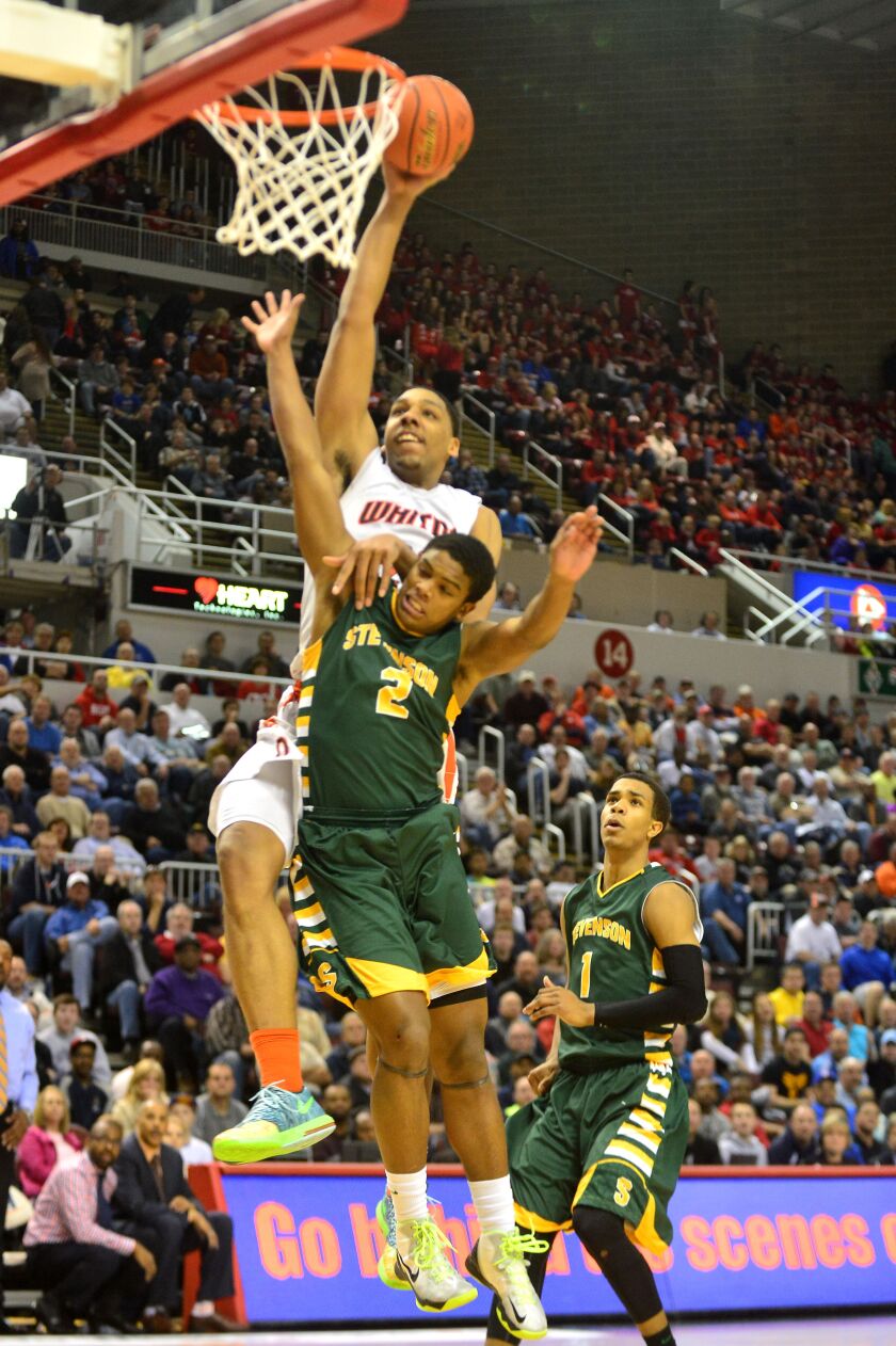 Jahlil Okafor of Young powers over Stevenson’s Cameron Green for a dunk.