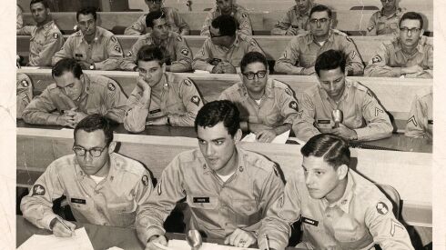 Ken Price (center front) served six years in the Army, mostly as a scriptwriter with the psychological operations unit.