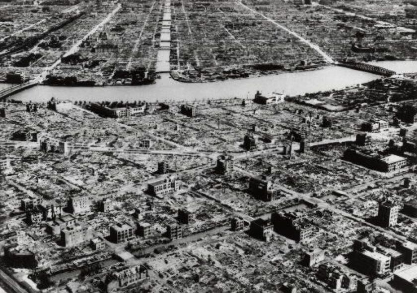 This aerial photo taken in 1945 shows the industrial section of Tokyo along the Sumida River in the aftermath of the firebombing raid. | AP Photo