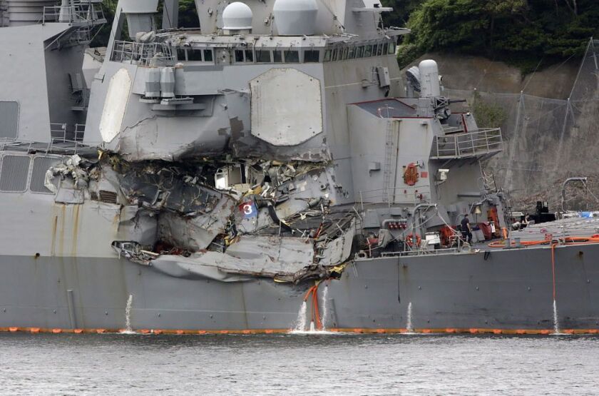 A damaged part of USS Fitzgerald is seen at the U.S. Naval base in Yokosuka, southwest of Tokyoon Sunday, June 18, 2017. | Eugene Hoshiko/AP