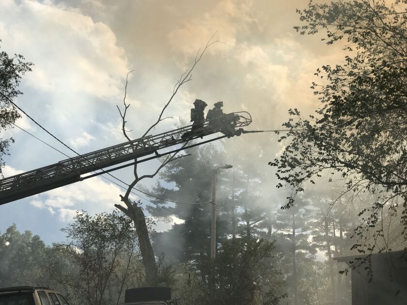 Two firefighters were hospitalized in a blaze that tore through a vacant home Monday afternoon in southwest suburban Orland Park. | Ray Hanania